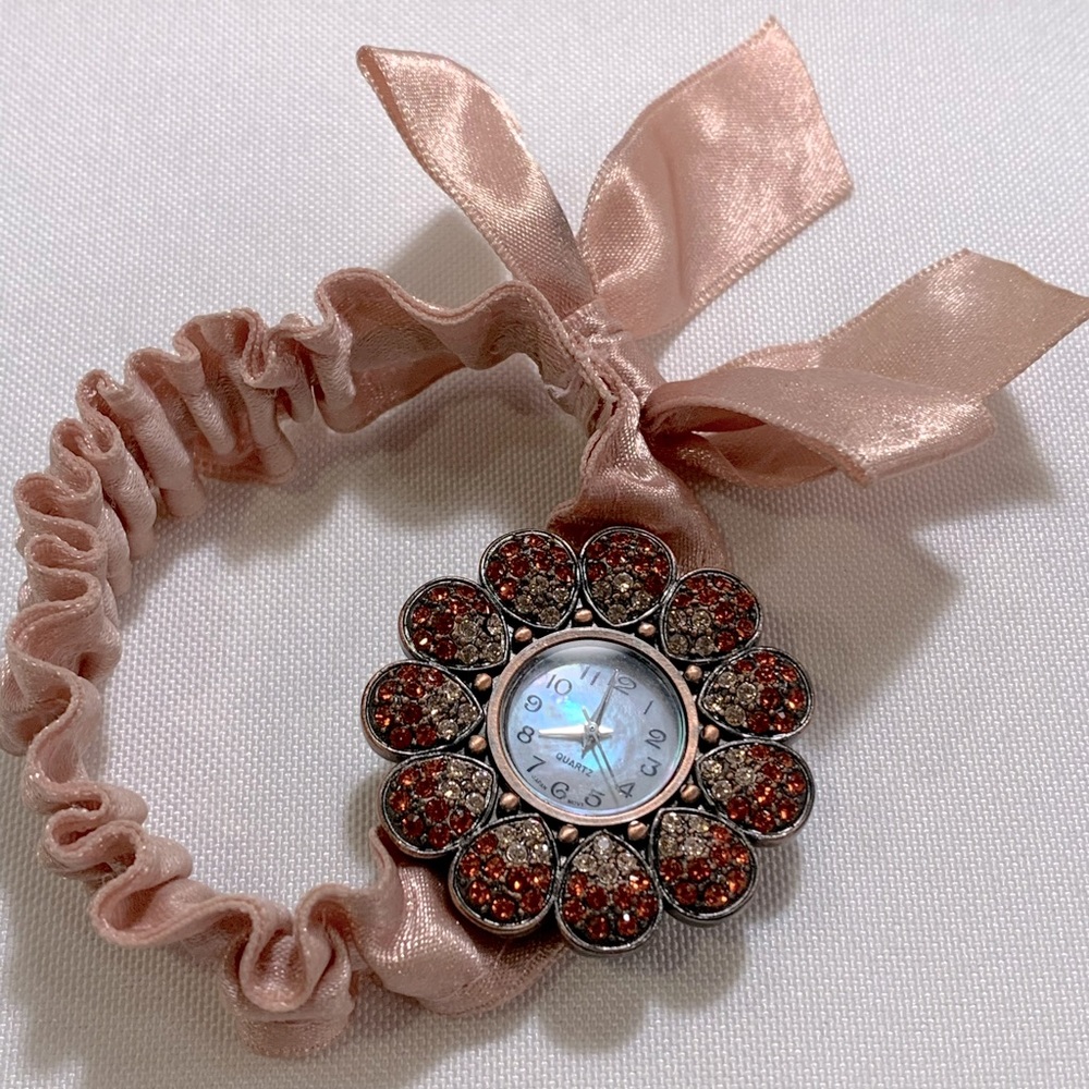 Pink ribbon/stretchy band, with red/pink crystal flower watch face